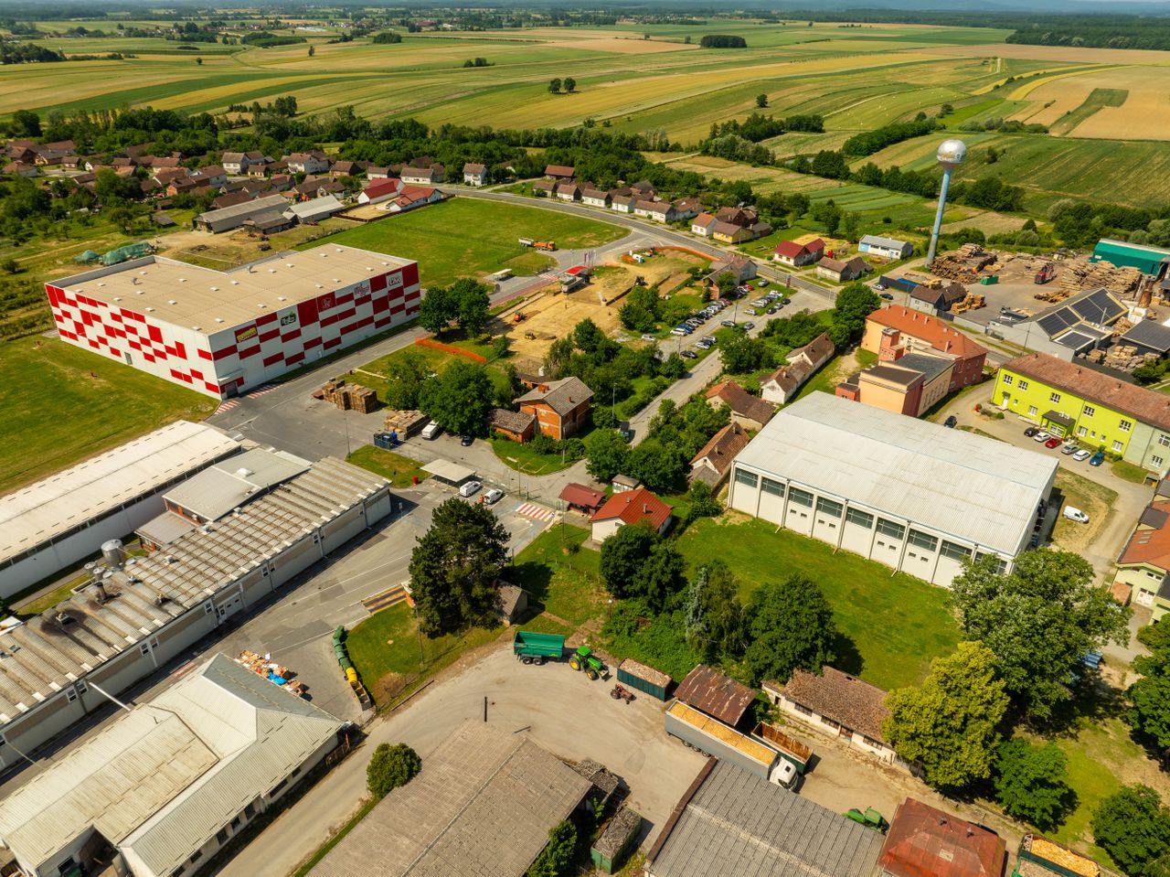 Aerial photograph of an industrial area in Hercegovac, Croatia, with rural surroundings.